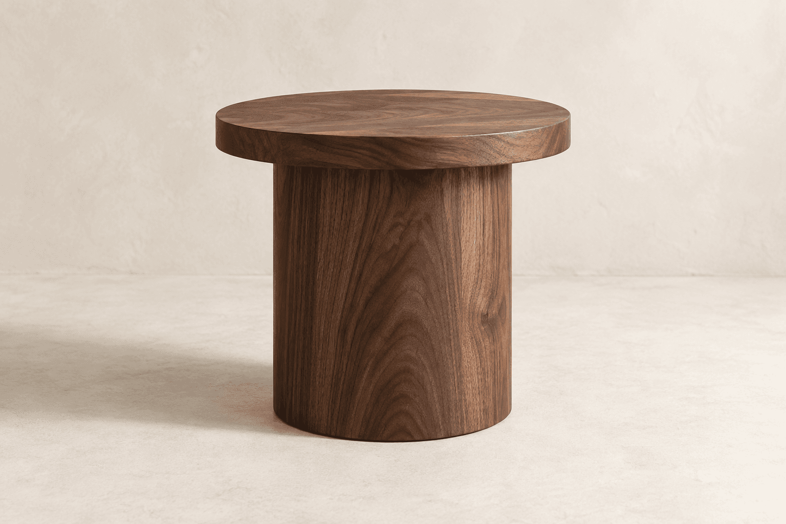Cylindrical solid walnut side table with a round top